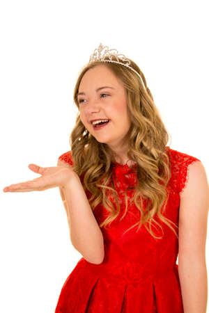A woman with down syndrome with a smile on her face and a crown on her head.の写真素材