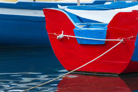 Small traditional fishing boat, made of wood, coloured, painted, Sicilyの写真素材
