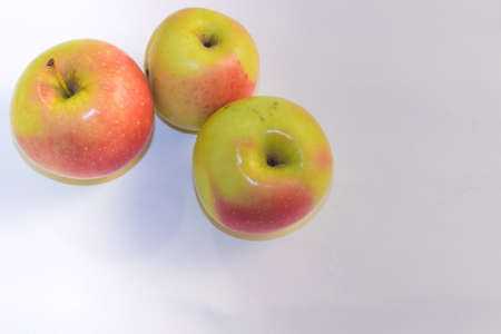 Three apples on white backgrounfの写真素材