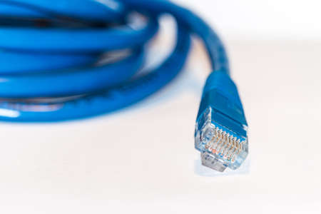 The blue internet cable on white backgroundの写真素材