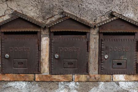 Old and vintage Mail Boxes on the street.の写真素材