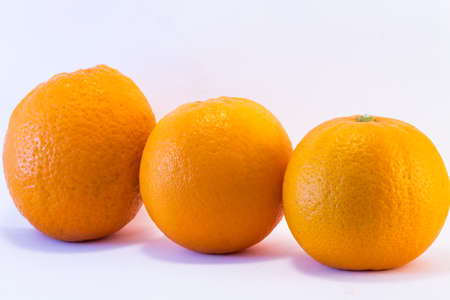 Trio oranges on white backgroundの写真素材