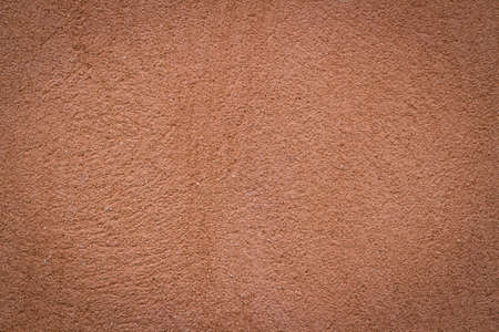 Orange wall background and texture with vignetting and blank copyspace for text or advertising.の写真素材