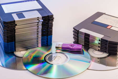 Progression of computer data storage media from floppy to USB flash stick through the DVD romの写真素材
