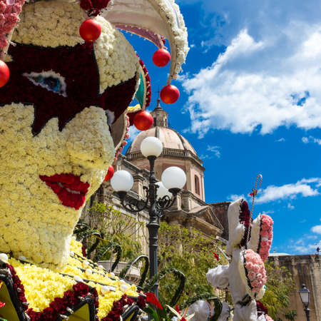 flowered mask with carnations and roses to celebrate the Sicilian springのeditorial素材