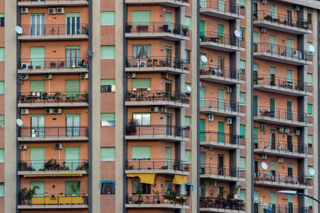 View of a facade of colored apartments with balconiesのeditorial素材