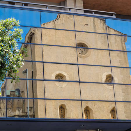 Italy: The Old church and modern building.の写真素材