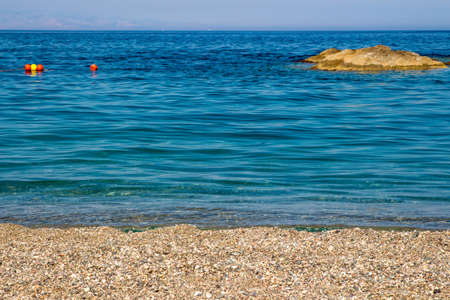 Sand the rocks and a blue Mediterranean seaの写真素材