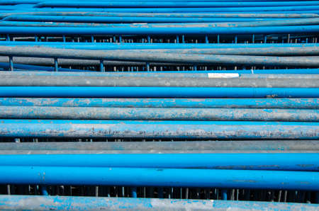 Horizontaly placed stainless steel tubes il blue colorの写真素材