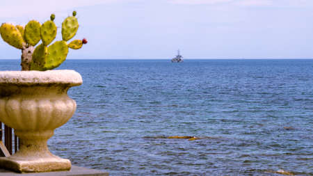 Military ship founding in the blue Mediterranean seaの写真素材