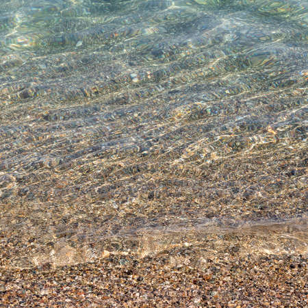 Sand the rocks and a blue Mediterranean sea