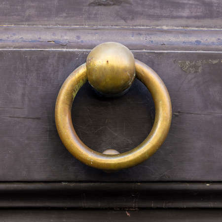 Close up of rustic old door in Florence, Italy.の写真素材