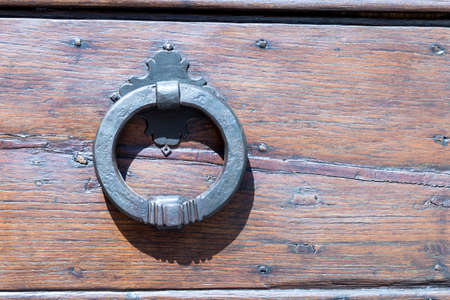 Close up of rustic old door in Assisi, Italy.の写真素材
