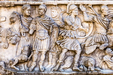 Roman bas-relief in the ancient stone wallsの写真素材