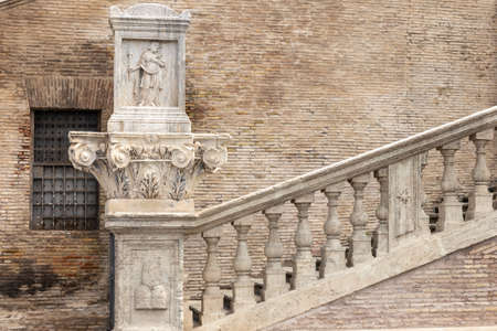 Ancient staircase of a Roman church. Detail of the bas-relief on the  chapiter