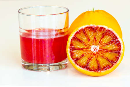 The glass with Sicilian red orange juiceの写真素材