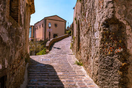 View of a small Sicilian village. Ancient stone roadの写真素材