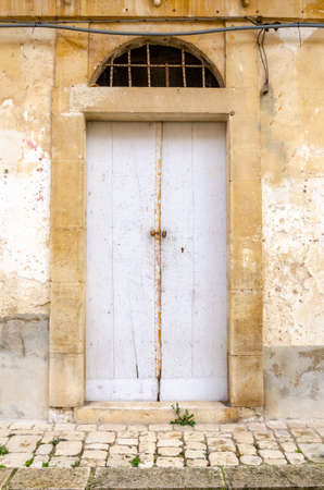 The Ancient door of a Sicilian houseの写真素材