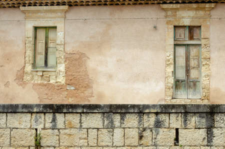 The  ancient window on stone wall, for backgroundの写真素材