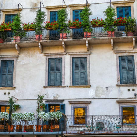 windows in the facades of ancient Venetian housesの写真素材