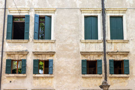windows in the facades of ancient Venetian houses