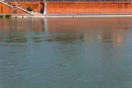 Italy: ancient medieval walls on the Adige riverの写真素材