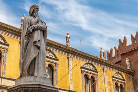 Statue of the great poet Dante Alighieri in Piazza dei Signori is a city square in Verona, Italy.の写真素材