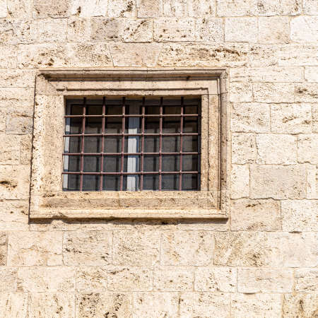 windows in the facades of ancient medieval houses