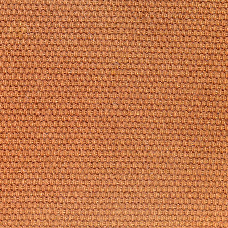 Rustic canvas fabric texture in dark orange woven color.の写真素材