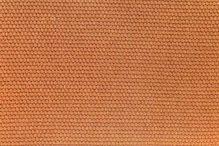 Rustic canvas fabric texture in dark orange woven color.の写真素材