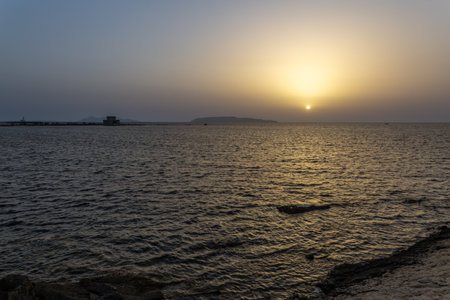 the wonderful sunset over the Sicilian seaの写真素材