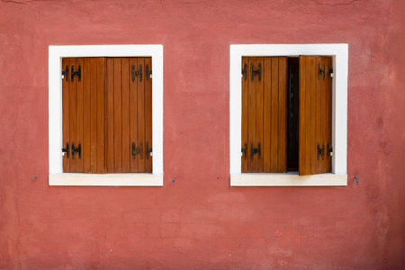 Doors and windows of ancient colorful Venetian houses