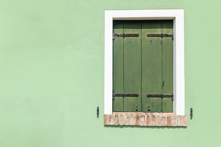 Doors and windows of ancient colorful Venetian houses
