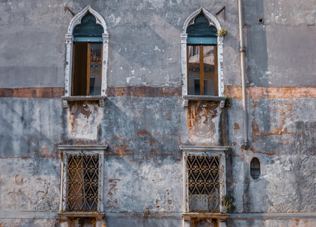 Doors and windows of ancient colorful Venetian housesの写真素材