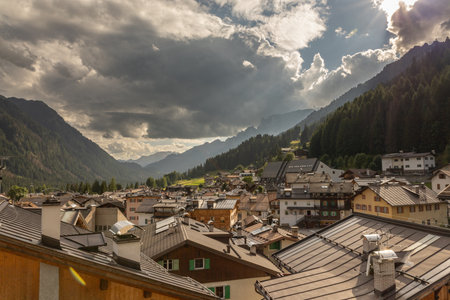 Charming mountain village under dramatic cloudy sky
