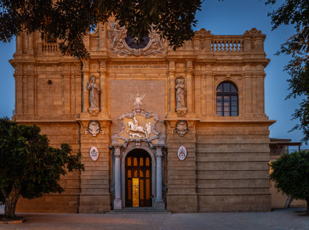 Ornate historic church illuminated by warm evening lightの写真素材