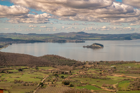 Serene landscape with islands and rolling fieldsの写真素材