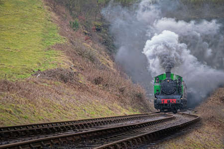 Steam train, locomotive smoking exiting tunnel. TKh 2944 was made in Polandのeditorial素材
