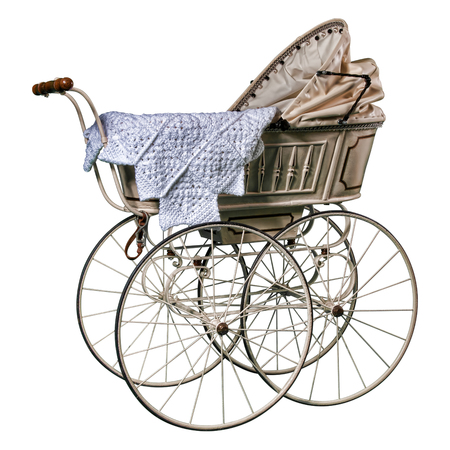 isolated edwardian pram in perfect condition, restored and against a while backgroundの写真素材