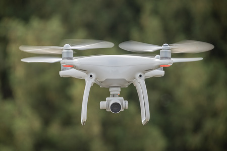 A close up of a drone in flight looking directly at the camera