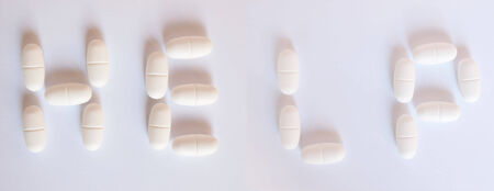 Help written with medical pillsの写真素材