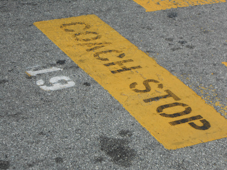 Coach Stop street sign on tarmac