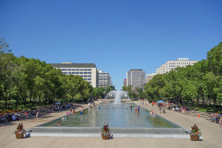 EDMONTON, CANADA - AUGUST 11, 2014: Tourists visiting the Alberta Legislature Building fountain poolのeditorial素材