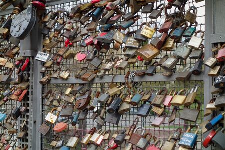 BYDGOSZCZ, POLAND - CIRCA APRIL 2016: Love lock padlock sweethearts locked to a fence to symbolize...