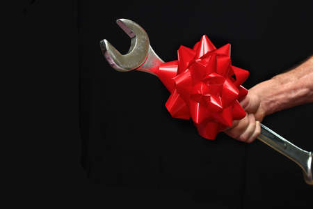 Man Holding a Big Wrenchの写真素材