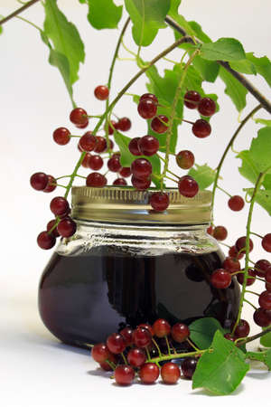Choke cherry jam sealer isolated on a white background.の写真素材