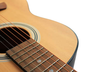 Close up of an acoustic guitar isolated on a white background