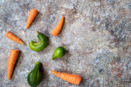 Flat lay of vegetables on a white wood background