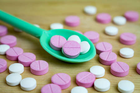 group of drugs on a spoon and wooden boardの写真素材