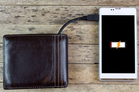 wallet with energy charge, charging smartphoneの写真素材